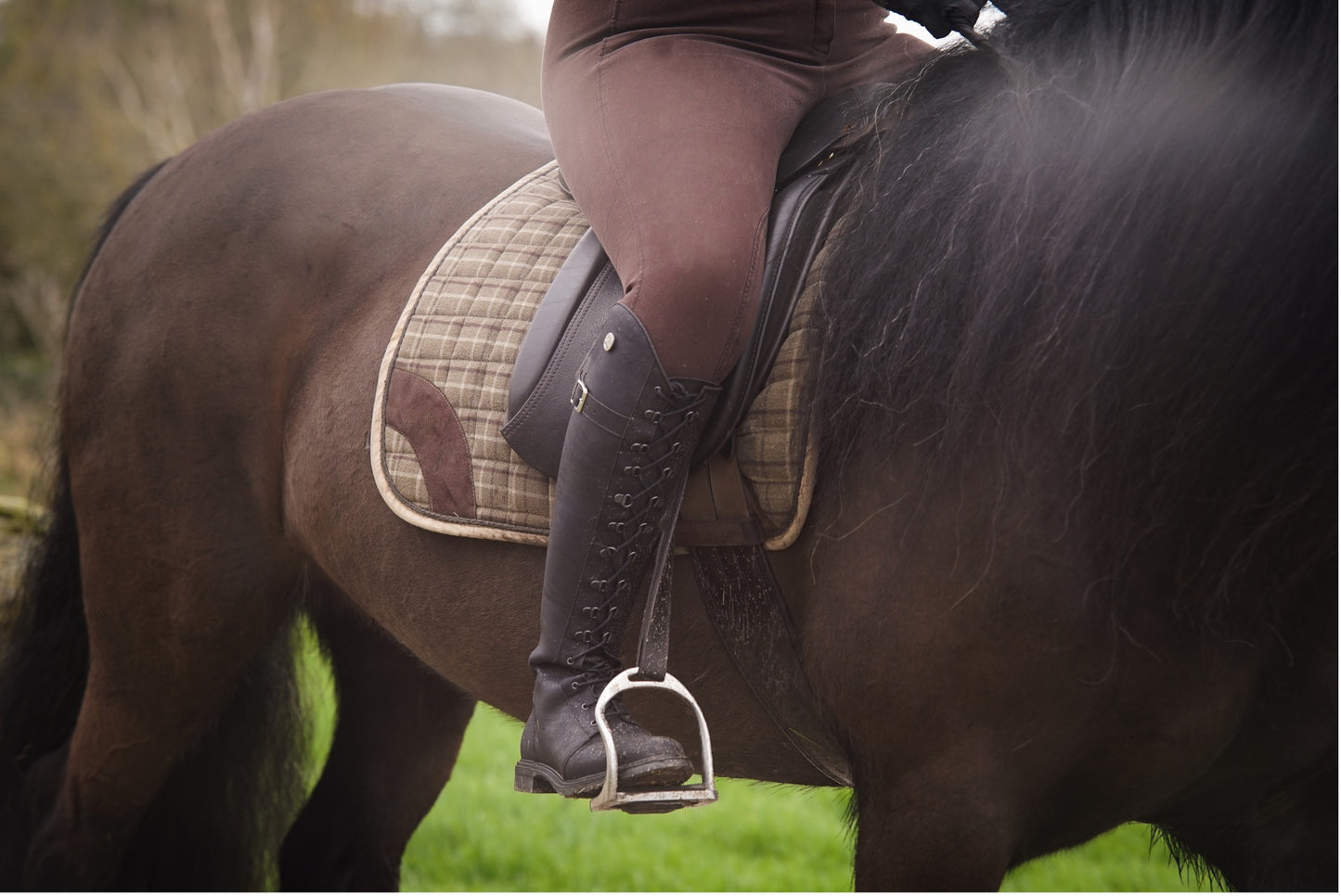 country boots for ladies being used on riding a native pony