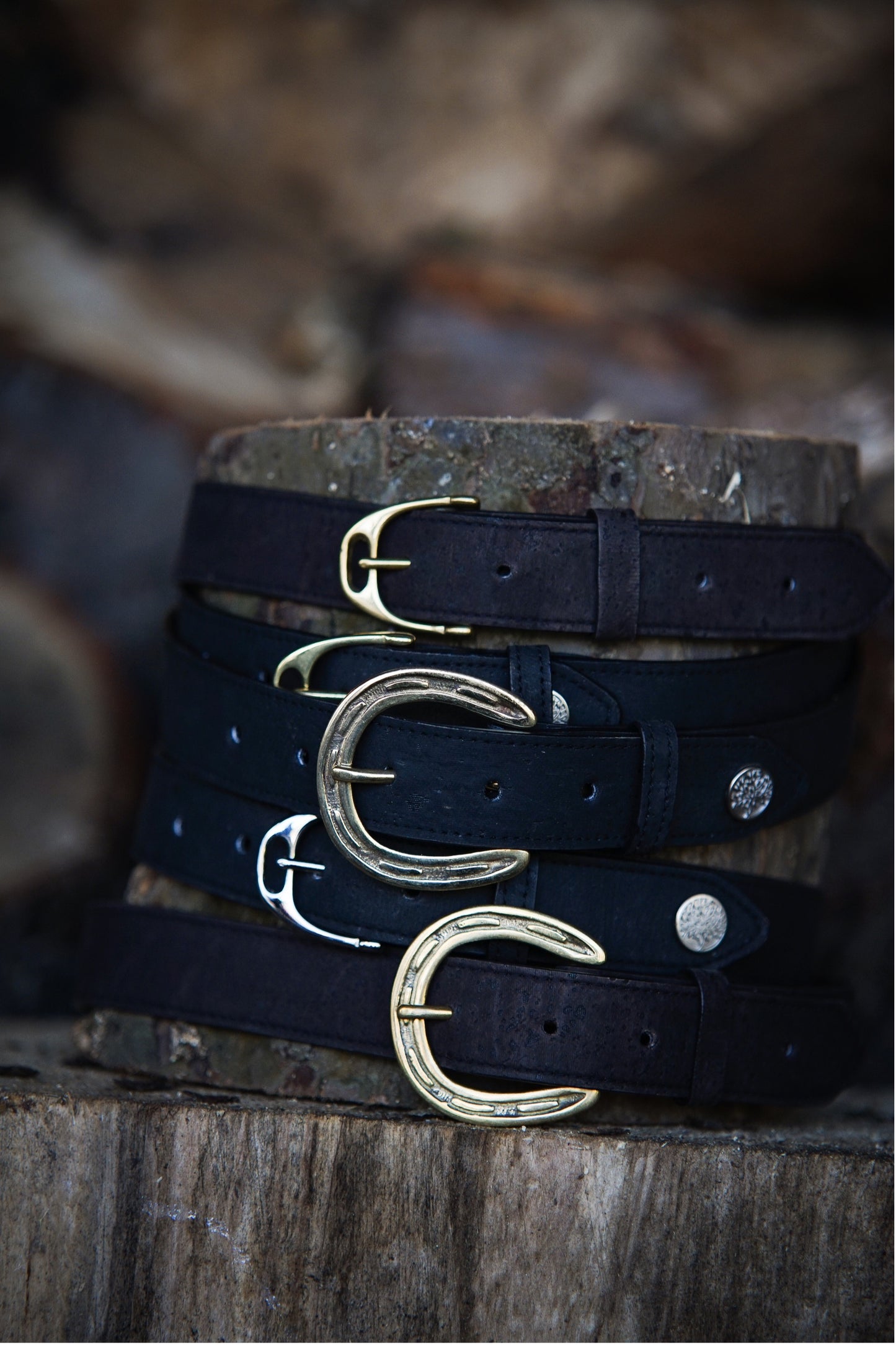 cork leather belts around a wooden stump